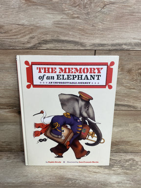 Cover of children’s book The Memory of an Elephant with illustration of elephant in uniform carrying suitcase and trombone