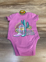 Pink baby onesie with cowboy boot, cactus, and sunflower design, 'Love Me Some Boots & Buc-Ees'