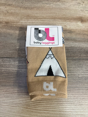 Tan baby leggings with white teepee pattern on wooden surface, baby leggings label visible