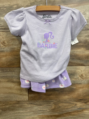 Lavender Barbie girls' outfit with puff sleeve top and floral shorts, laid on wood background