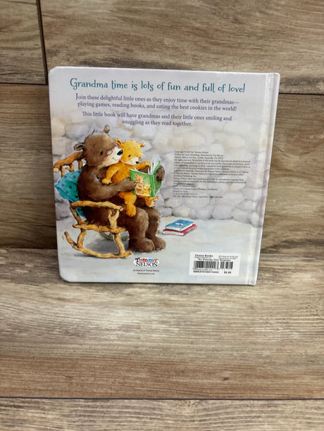 Back cover of Grandma Kisses board book with Grandma time is lots of fun and full of love and a grandma bear reading to a cub