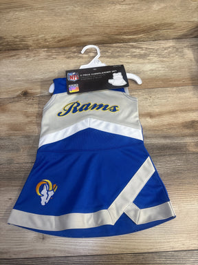 Front view of 12m Los Angeles Rams cheer jumper showing Rams script and ram patch on wood background