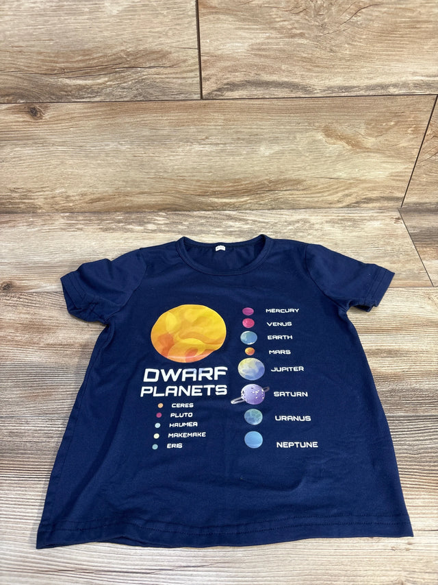 Front flat lay of navy toddler t-shirt showcasing 'DWARF PLANETS' graphic with labeled planet illustrations on wood floor