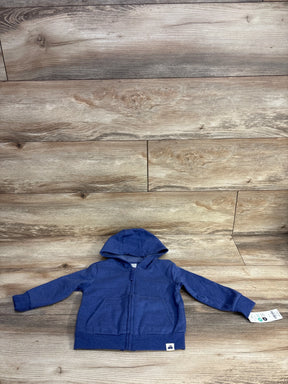 Blue toddler zip-up hoodie with hood and front pockets on wood floor backdrop
