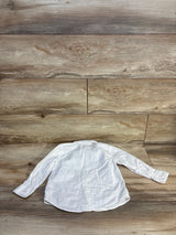 Back flat-lay of Boys Old Navy white long-sleeve button-up shirt, size 3T, showing curved hem and button cuffs on wood floor