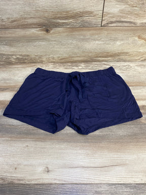 Flat lay of navy Gap Body maternity modal shorts showing elastic drawstring waistband and short inseam on light wood background