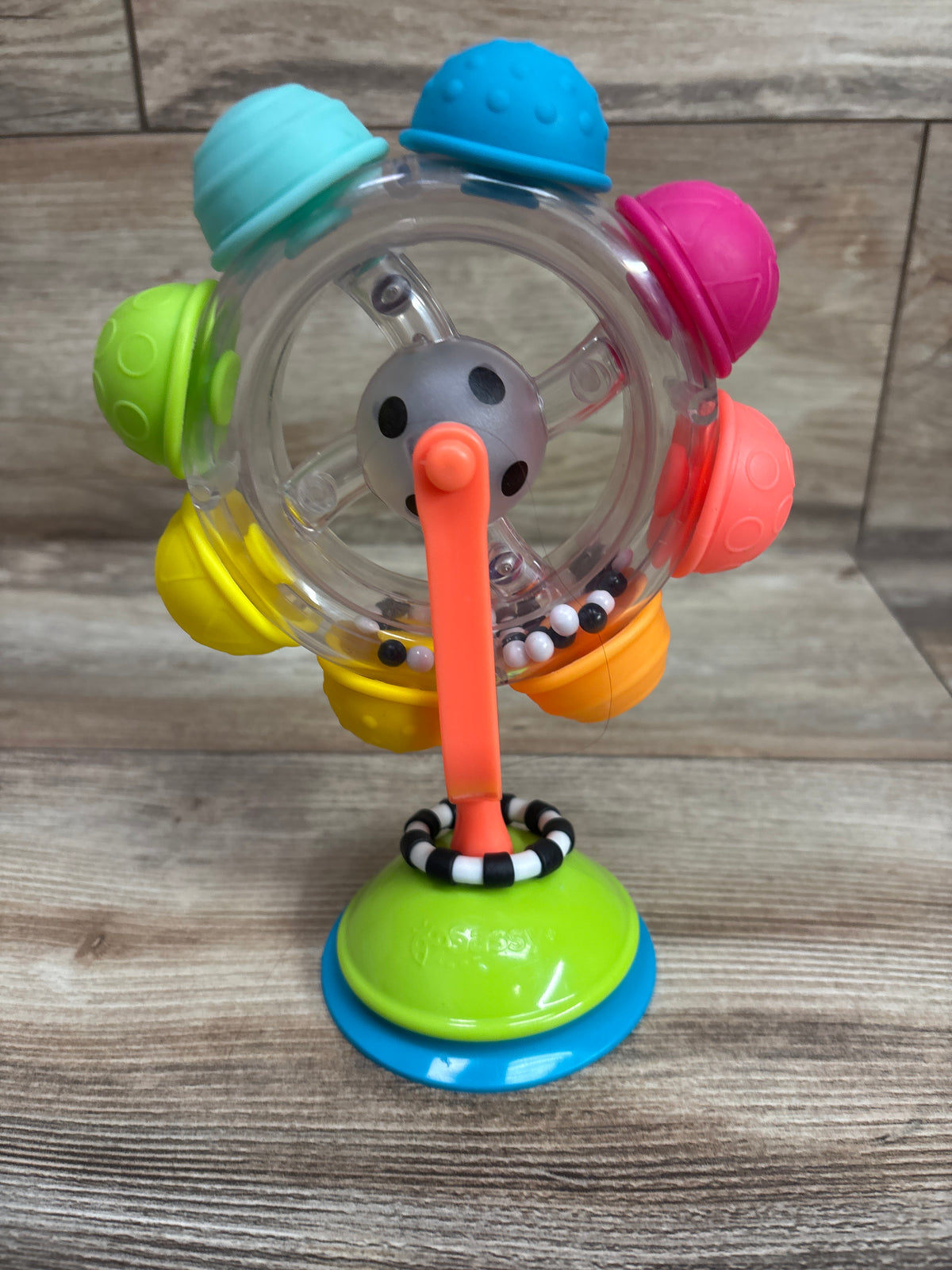 Sassy Light-Up Rainbow Reel Suction Base Toy