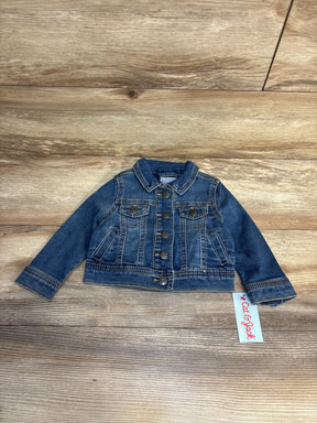 Cat & Jack toddler denim jacket with button front, laid flat on wood floor for kids clothing resale