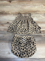 Toddler leopard print sleeveless top and bloomer shorts set on wood background