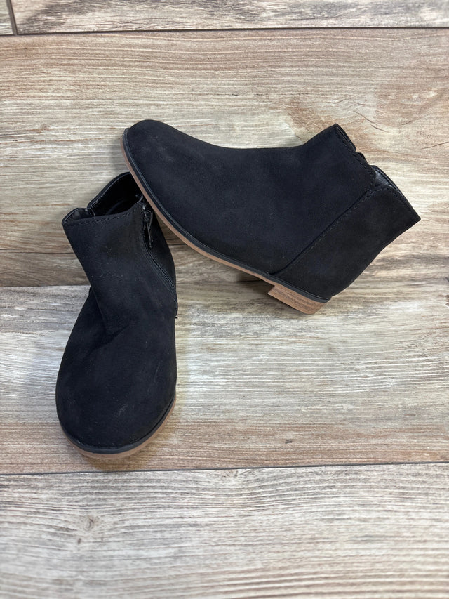 Black suede ankle boots for kids with side zipper on wood floor
