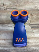 Front view of GeoSafari Jr. talking microscope with dual eyepieces with orange rims and control buttons on wood floor