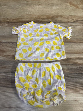 Flat lay of Cat & Jack two-piece lemon-print ribbed top and bloomer with ruffle sleeves and elastic waist on wood floor