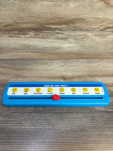 Blue children's feelings slider toy with emoji faces and emotion labels on wood surface