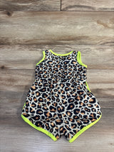 Flat-lay front of leopard tank romper showing tan-and-black print with neon yellow trim on wood floor, size 6–9M