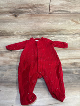 Flat lay of red Tommy Hilfiger baby sleeper 0-3 months showing ribbed knit, snap front and footed legs on wood background