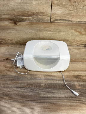Front view of Munchkin Bright & Warm wipe warmer showcasing translucent flip lid and included power adapter on wooden tabletop background