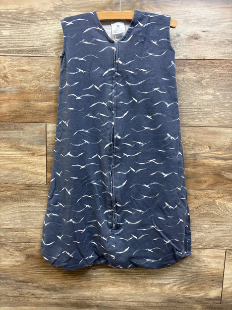 Front view of Halo SleepSack in grey with white bird pattern, full-length zipper, and rounded bottom on a wooden background