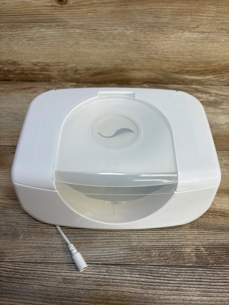 White baby bottle warmer with clear lid and power cord on wood surface