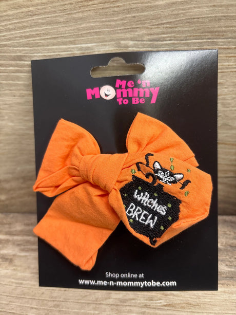 Orange embroidered Halloween cloth hair bow with a 'Witches Brew' cauldron design