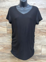Front view of black Time and Tru maternity shirt showing V-neck, short sleeves and side ruching on mannequin against wood plank background