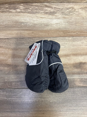 Pair of black children's winter mittens with white trim and brand tag on wooden surface