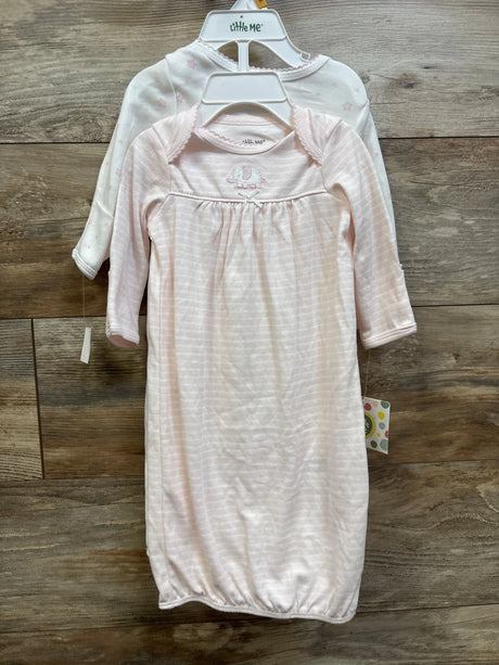 Two Little Me baby sleep gowns in pink and white, size 0-3m, on a wooden background.