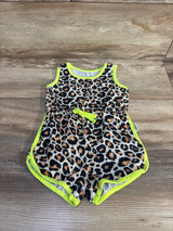 Top view of baby leopard print tank romper showcasing neon yellow trim, waist bow and snap crotch closures on wood floor