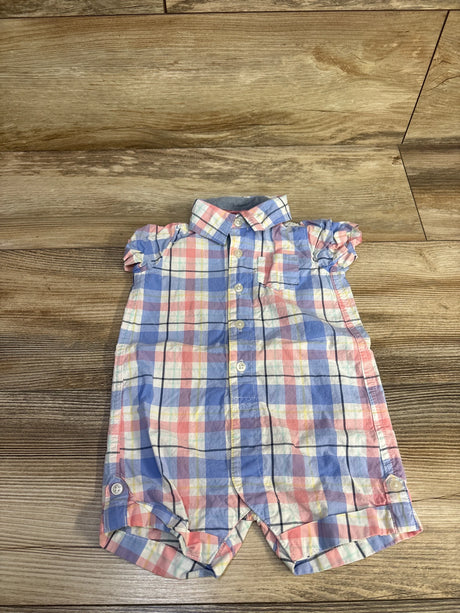 Flat-lay front of Carter's pastel plaid shortie romper with collar, button front and ruffle cap sleeves on wood floor