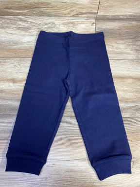 Navy blue toddler pants on wooden floor, kids clothing apparel
