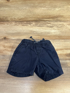 Flat lay Cat & Jack navy drawstring shorts with elastic waistband and front pockets, size 12 months