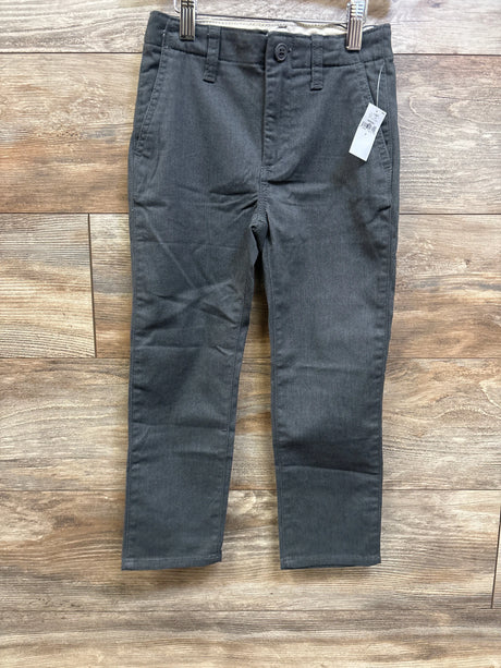 New Gap Kids uniform stretch straight pants in grey, size 5T, on a wooden background.