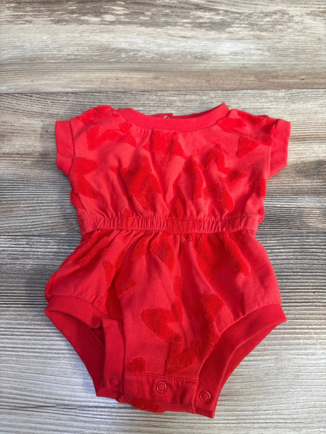 Flat lay of red Cat & Jack newborn terry romper showing short sleeves, elastic waist and three snap crotch closures on wood