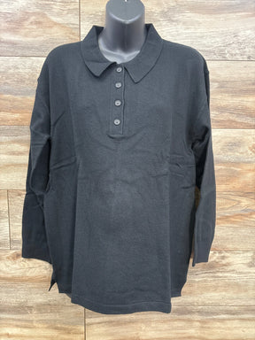 Black long sleeve collared knit shirt for kids with button front, displayed on mannequin