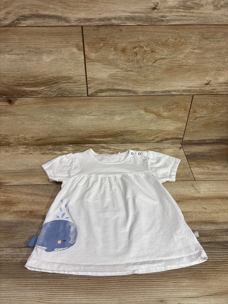 White Liegelind whale print toddler shirt in size 3T on a wooden background
