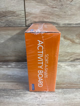 Side view of Lakeshore Sort-A-Shape Activity Board box with orange packaging showing ACTIVITY BOARD text on wood background