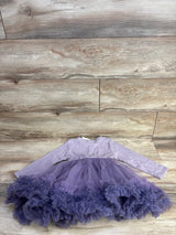 Flat lay of purple ribbed long-sleeve toddler dress (5T) showcasing layered tulle skirt with ruffled hem on light wood background