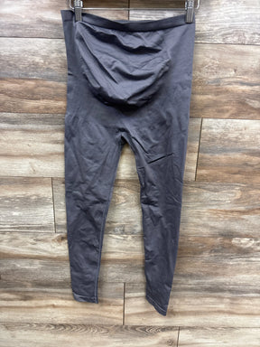 Gray maternity leggings with over-belly panel displayed on wooden floor