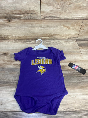 Purple baby onesie with "Born To Be A Legend" text and a yellow Viking helmet logo, NFL tag visible