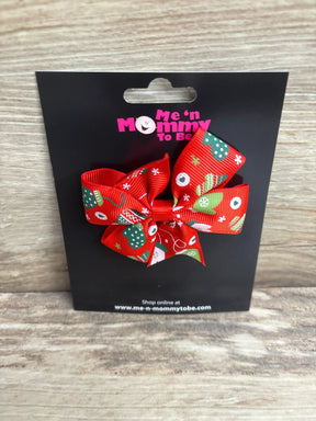 Red Christmas hair bow with green trees and snowflakes on black card