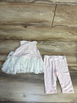 Baby pink lace dress and leggings set for girls on wood background