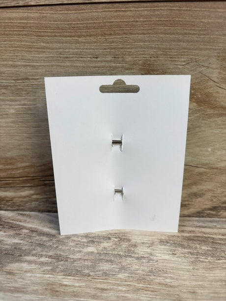Front view of 2-pack brown hair bows backing card showing two silver alligator clips on light wood background