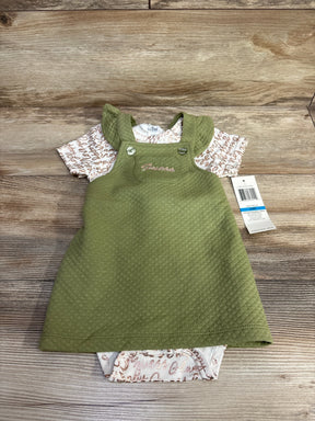 Olive green baby dress with short sleeve printed onesie on wood background, resale baby clothes