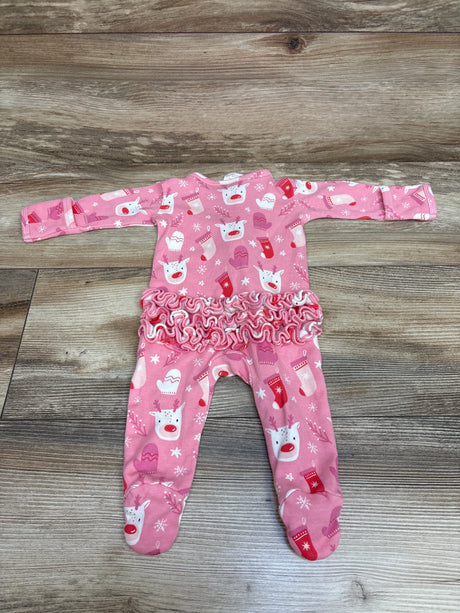 Front view of pink Siix reindeer zip footie sleeper with ruffled waist, long sleeves, and attached feet on wood