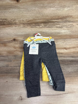 Cloud Island 3-pack baby pants set in gray, yellow, and polka dot on wood surface