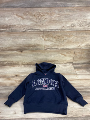 Navy blue kids London England hoodie with front pocket on wooden floor