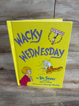Yellow children's book titled Wacky Wednesday by Dr. Seuss with illustration of a child and winged boot