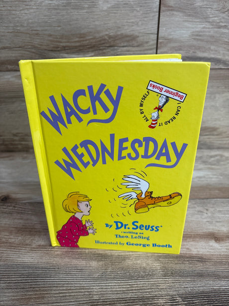 Yellow children's book titled Wacky Wednesday by Dr. Seuss with illustration of a child and winged boot