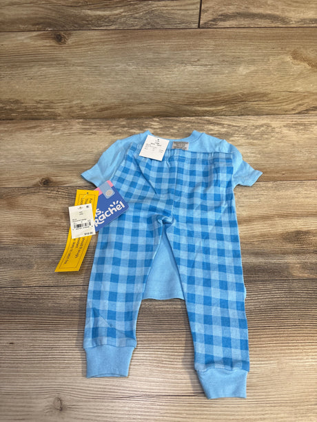 Flat lay of 2-piece Sleepy-Saurus toddler pajama set showing light-blue short-sleeve top and blue gingham pants with tags on wood floor