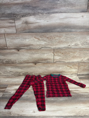 Red and black plaid kids pajamas set on wooden floor