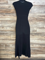 Front view of black maternity cap-sleeve maxi dress showing empire waist and long skirt on mannequin on wood background